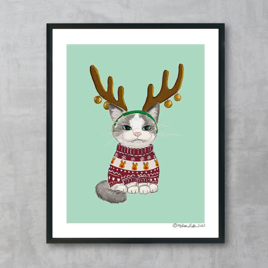 A fine art print featuring a grumpy cat begrudgingly wearing a Christmas sweater and reindeer antlers