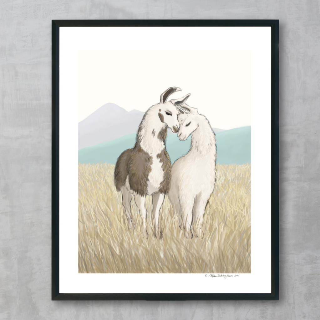 A fine art print featuring 2 llamas resting their heads against each other in a grassy field